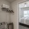 a bedroom with a bed and a fan