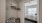 a bedroom with a bed and a fan