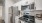 a kitchen with white cabinets