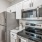 a kitchen with white cabinets