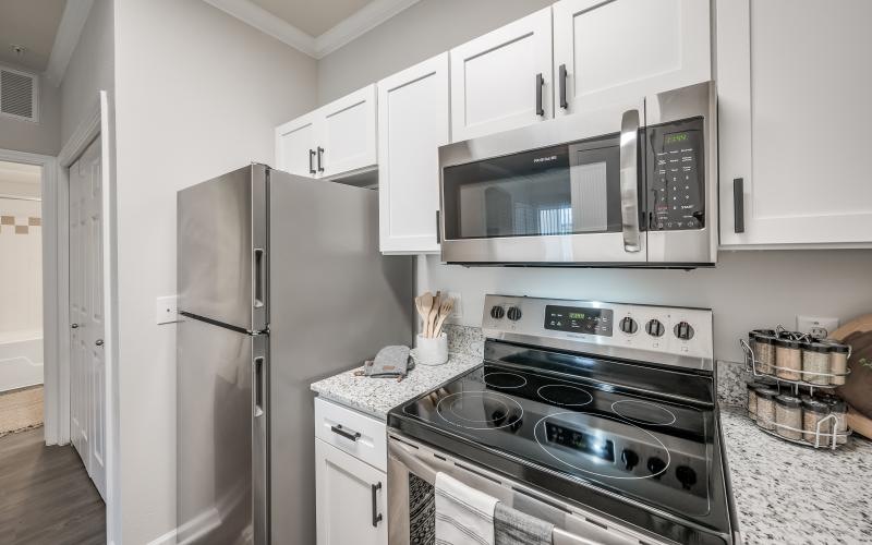 a kitchen with white cabinets