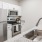 a kitchen with white cabinets
