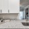 a kitchen with white cabinets
