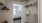 a bedroom with a bed and a mirror