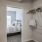 a bedroom with a bed and a mirror