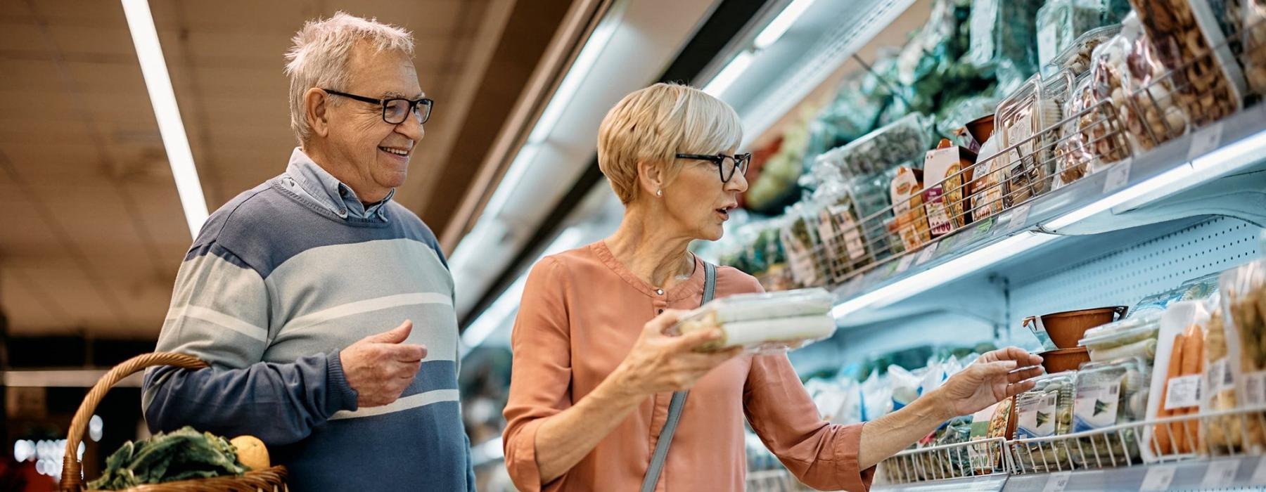 a man and woman grocery shopping
