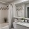 a bathroom with a tub sink and toilet