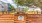 a wooden fence in front of a building