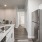 a kitchen with white cabinets